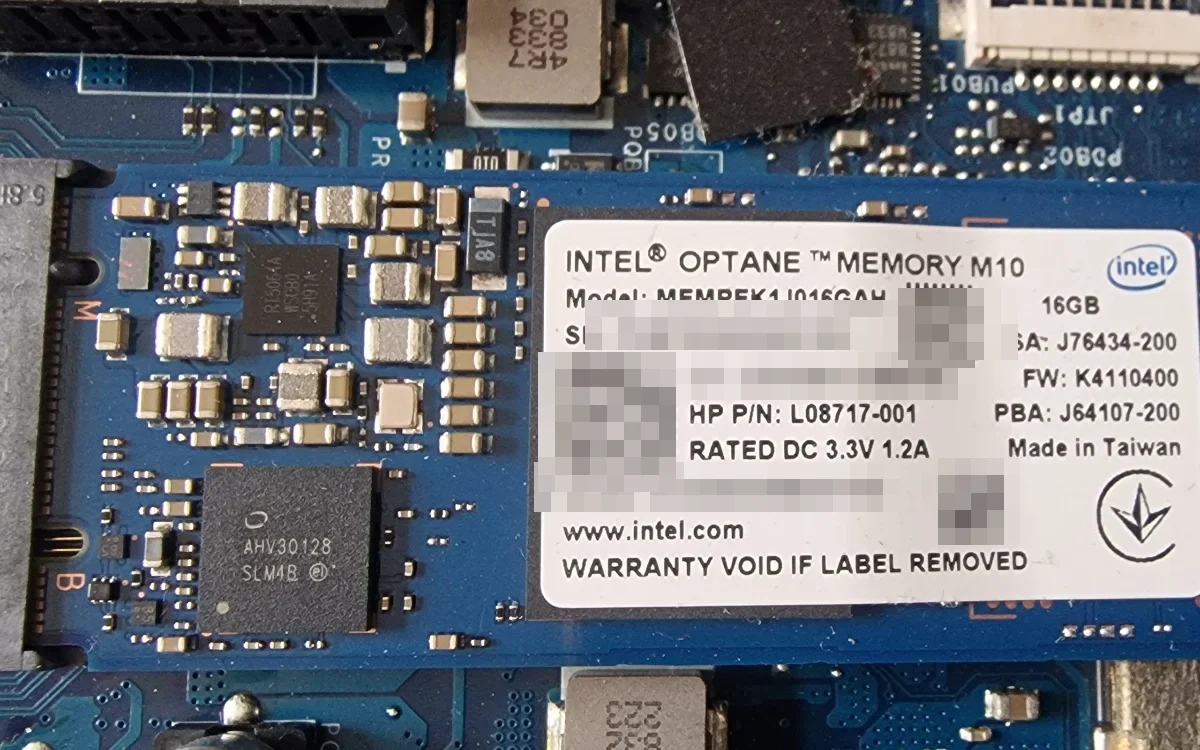 A 16GB Intel Optane M10 cache module removed from a laptop chassis during a rebuild